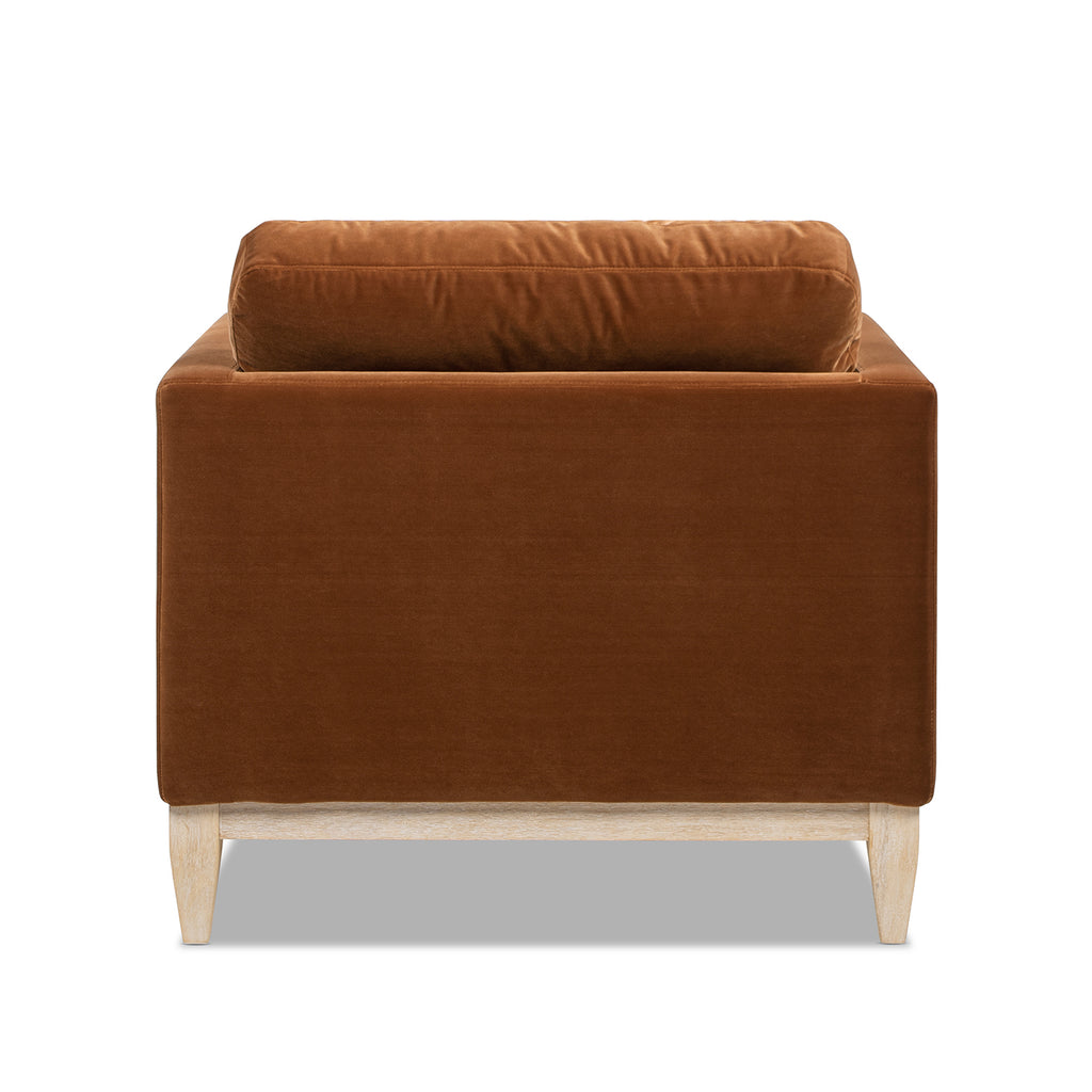 Rear view of Knox 65' burnt orange velvet chaise lounge chair with clean, modern lines and light wood legs for farmhouse decor.