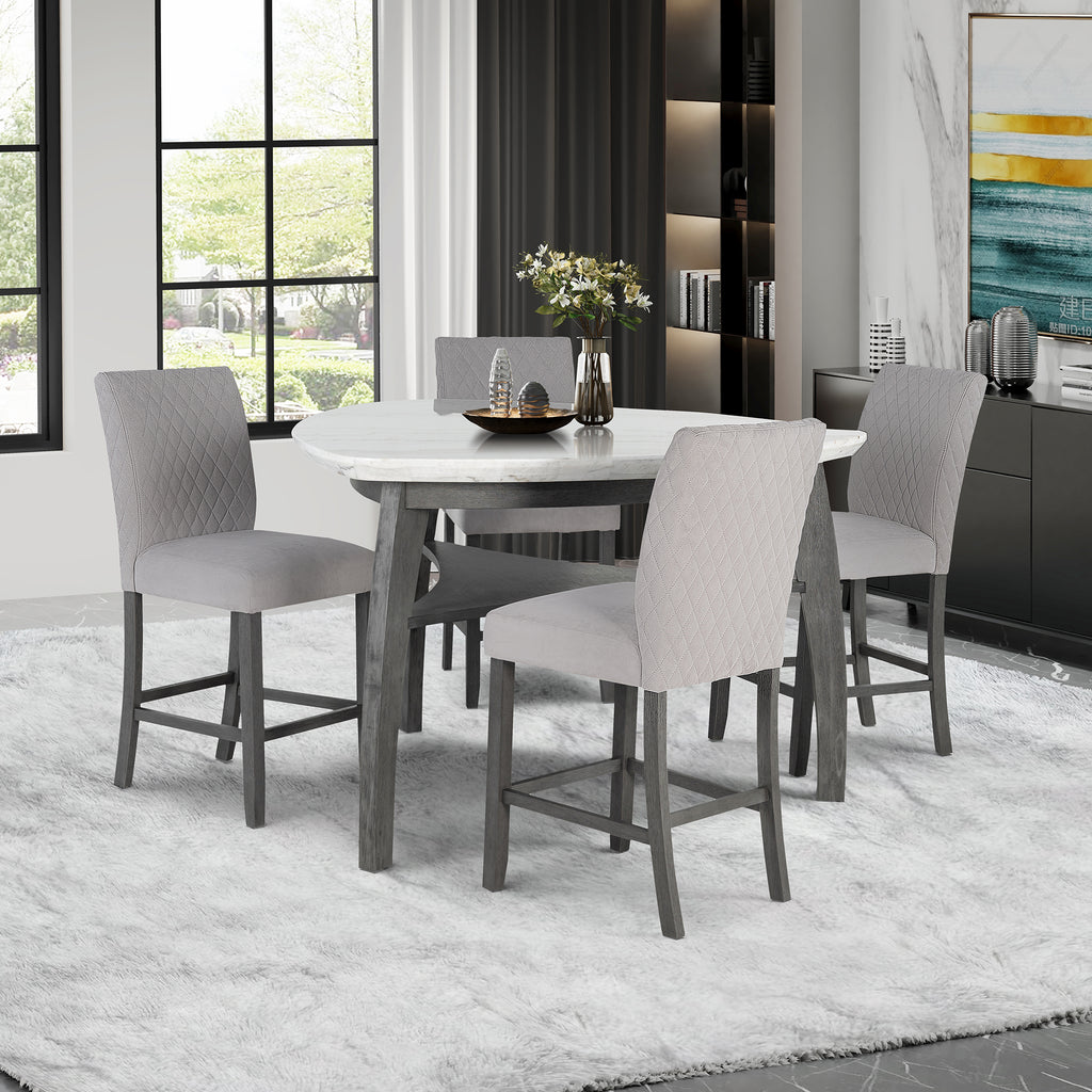 Jasmine Bar Table in a bright dining room with grey chairs, featuring a grey marble top and arched legs, seats 4 for casual meals.