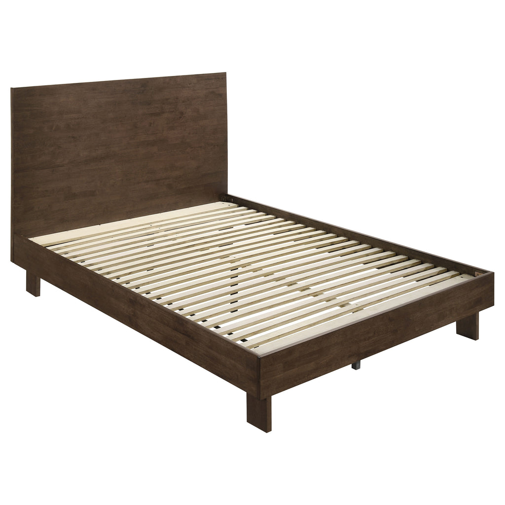 Warm brown solid wood queen platform bed featuring a clean, modern panel headboard and natural wood support slats.