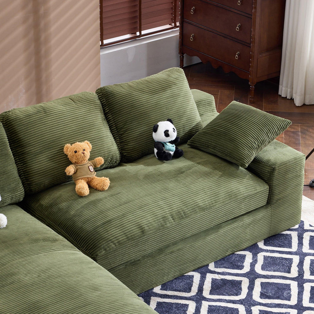 Green Corduroy Sofa with Cushions and Pillows.
