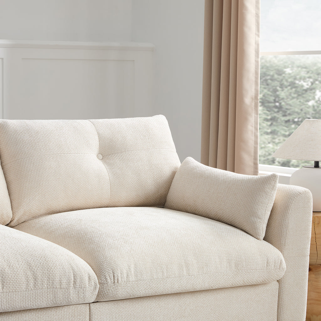 Close-up of plush corner seat on modular sectional sofa with soft backrest and pillow. Designed for cozy living room relaxation.