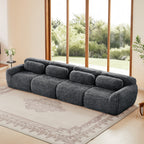 149'' modular plush sofa in dark grey with no assembly, placed in a bright living room with large windows and beige rug.