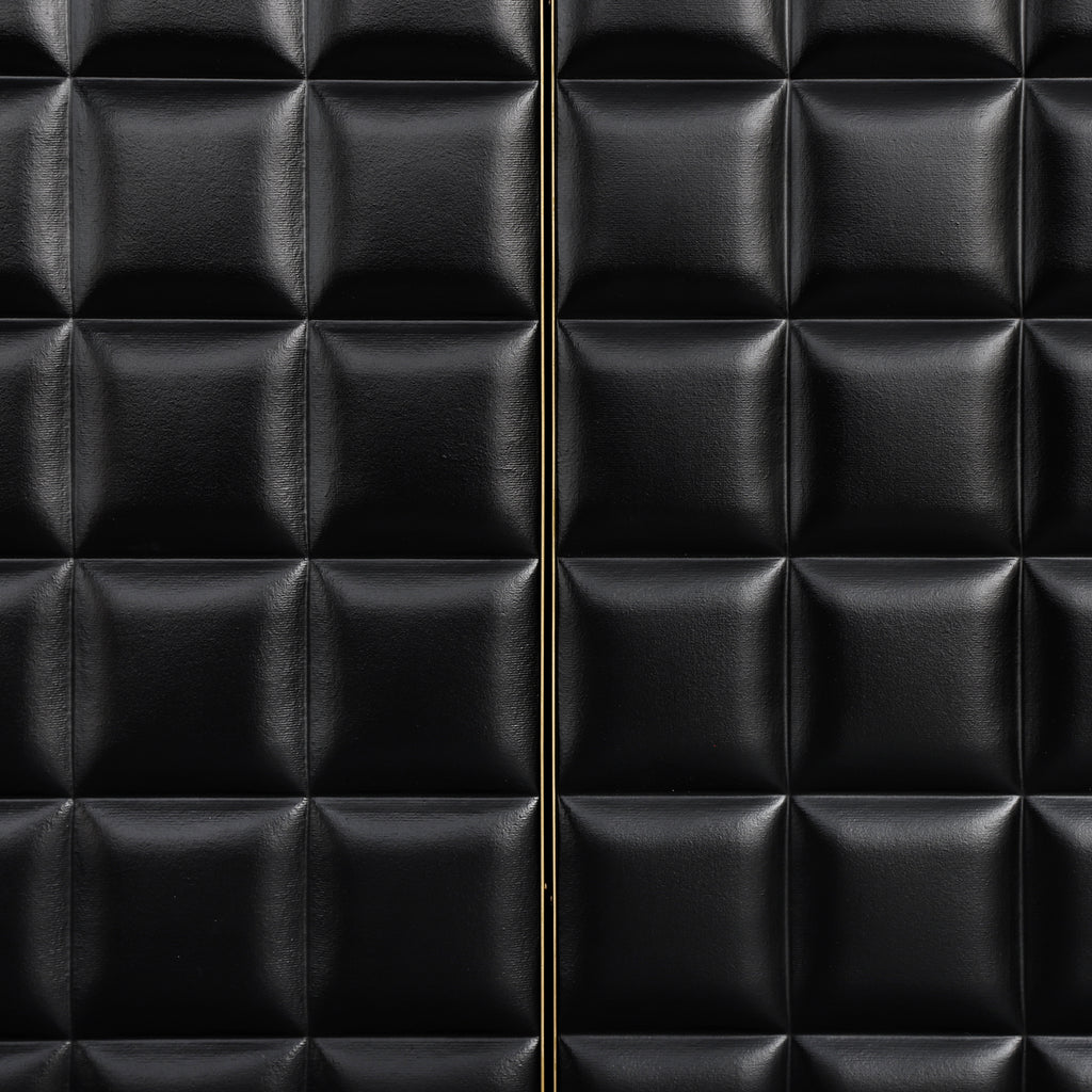Close-up of geometric door design on 4-Door Storage Cabinet featuring black padded panels and gold metal trim for a modern look.