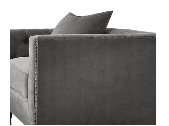 Close-up of Sidonia Gray Velvet Chair with Pillow armrest and nailhead trim, emphasizing luxurious texture and refined craftsmanship.