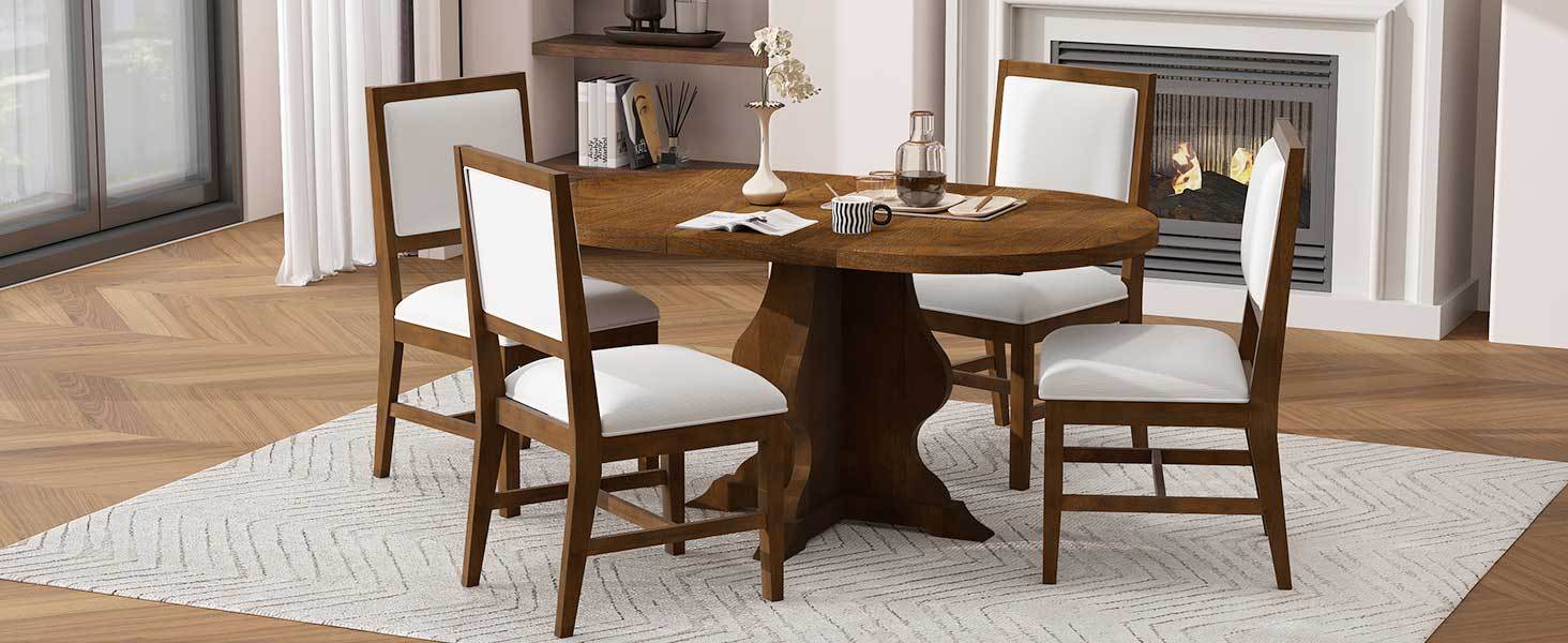 Angled view of farmhouse dining set with oval extendable table and white cushioned chairs. Enhances dining room aesthetics.