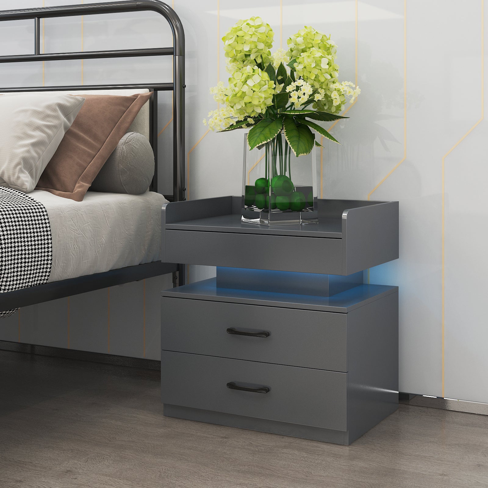 Modern dark gray nightstand with two drawers, black handles, and glowing blue under-shelf LED lighting next to a bed.