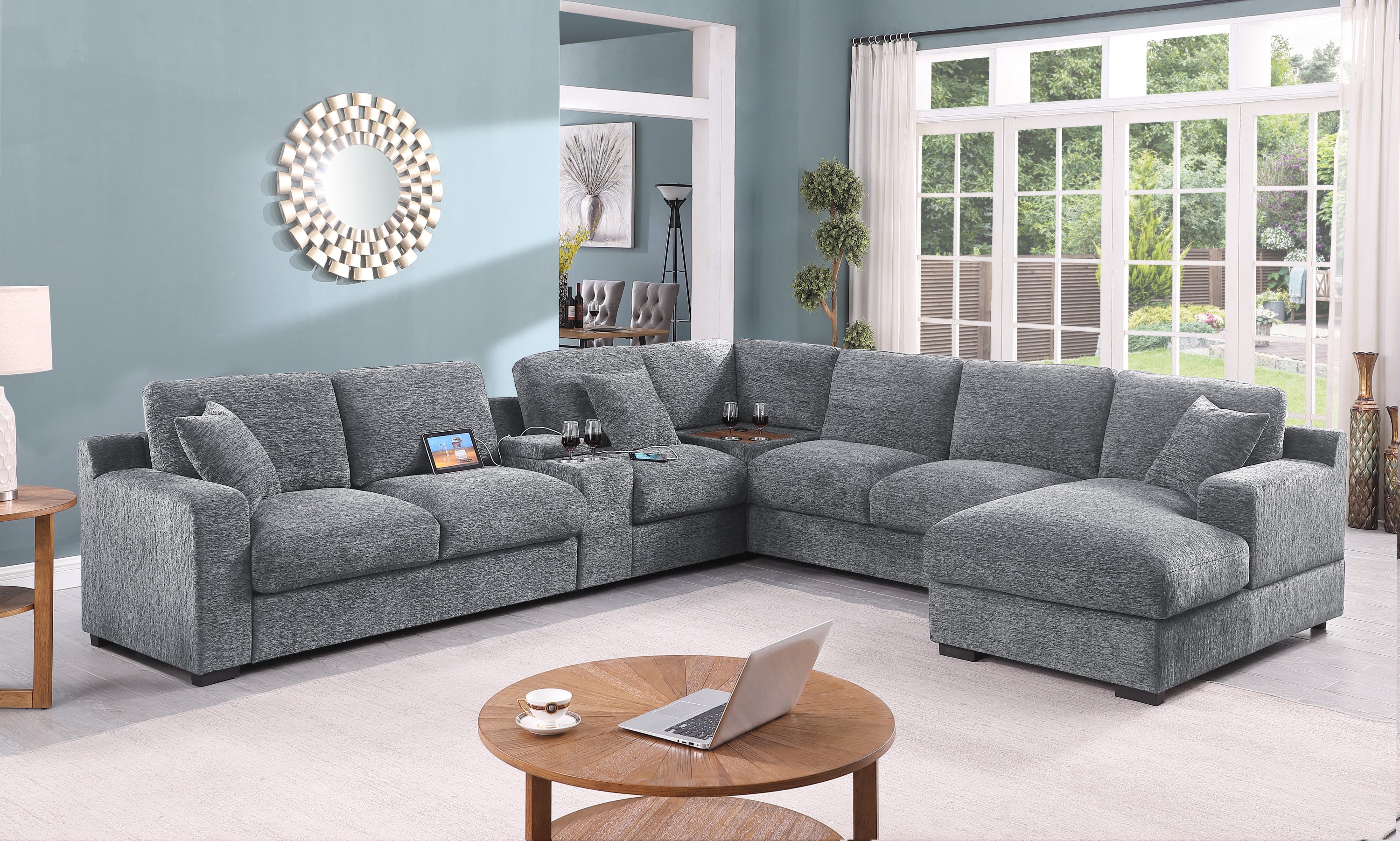 Corner sectional sofa with charging ports in light gray fabric, featuring chaise and cupholders, styled in a modern living room.