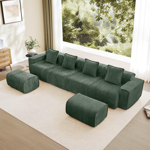 Modular Green Sofa with Throw Pillows and Ottomans.