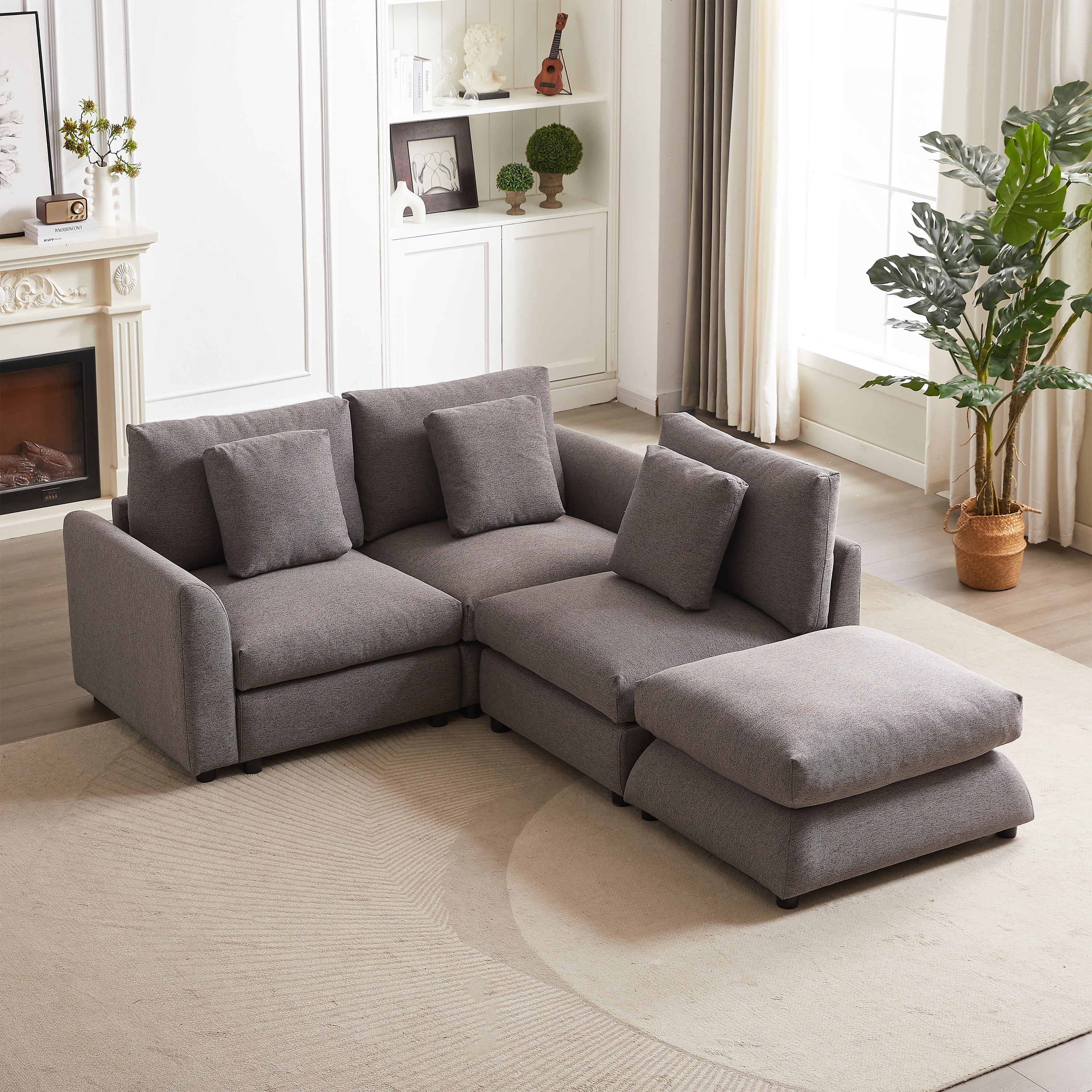 Top view of modular sofa with ottoman in gray fabric, arranged in a compact L-shape for small living rooms or apartments.