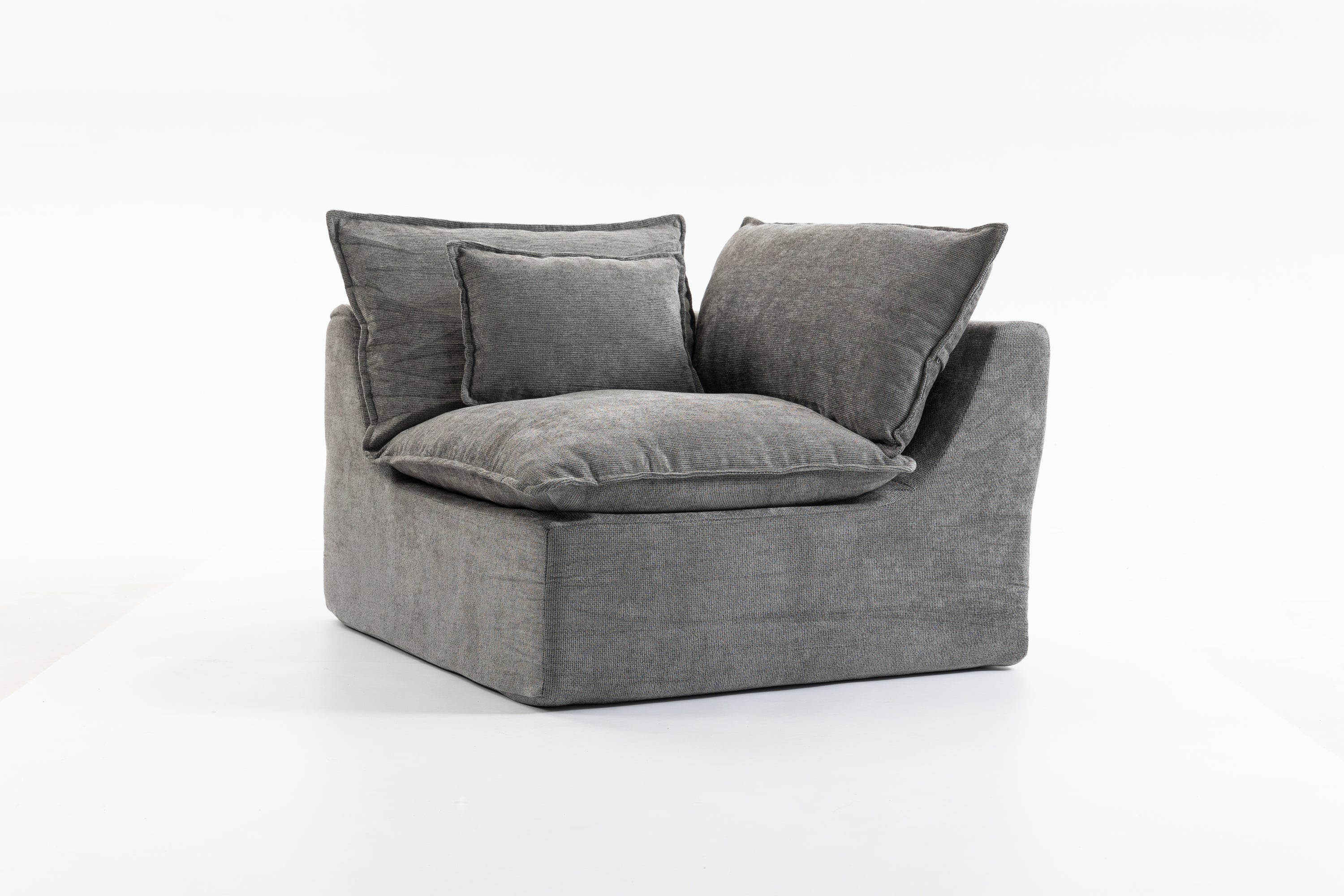 Angled view of a single modular seat from the Cloud Couch collection with plush cushions and soft velvet fabric.