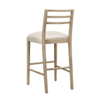 Back-side angle of Ladder Back Bar Stool emphasizing the curved wooden frame and neutral fabric seat.