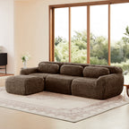 Three-seat chocolate plush modular sofa with movable ottoman, shown in extended layout for versatile living room arrangements.