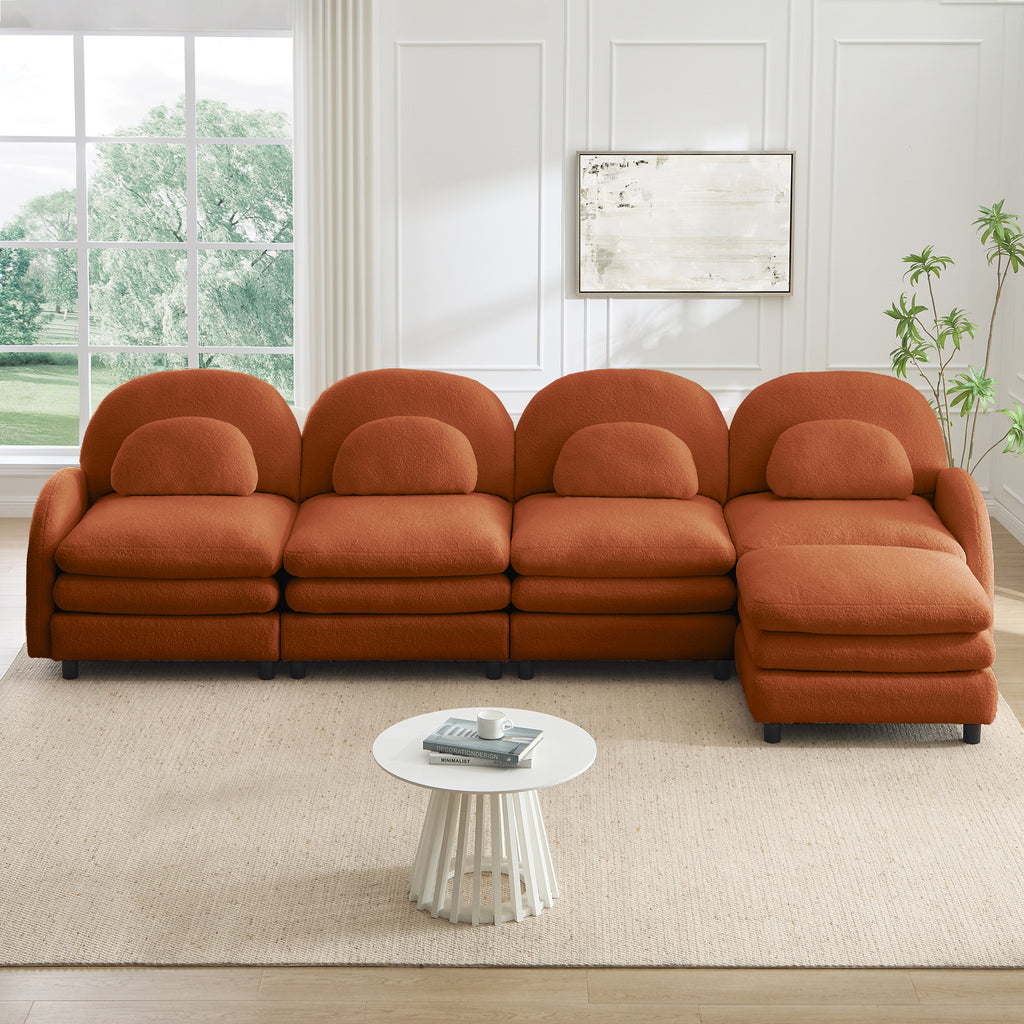 Orange, 4-seat modular teddy fabric sectional with curved backs, lumbar pillows, and a movable ottoman.