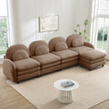 Camel teddy fabric 4-seater modular sofa with curved backrests, lumbar pillows, and a movable ottoman.