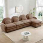 Camel teddy fabric 4-seater modular sofa with curved backrests, lumbar pillows, and a movable ottoman.