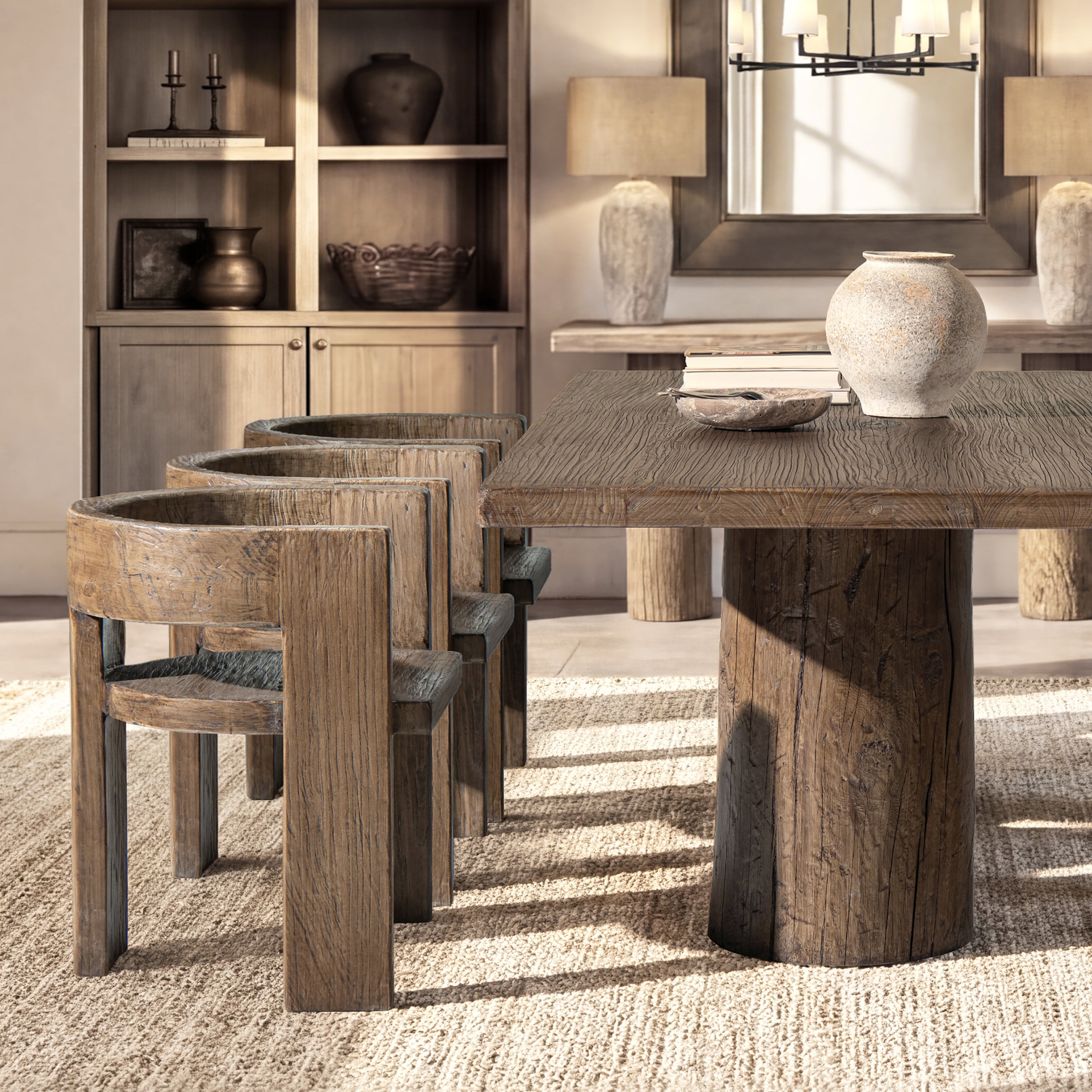 Sculptural dining chair in medium-dark reclaimed elm with a curved back, rustic texture, and modern architectural frame.