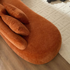 Top view of the chaise section of the Oversized L-Shape Sofa, showing plush cushions and curved modern design on a neutral rug.