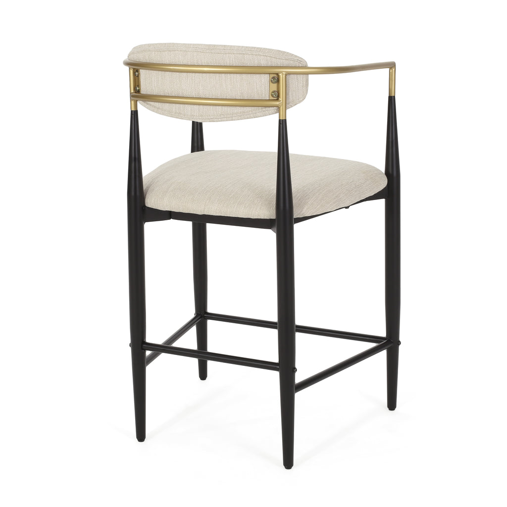 Back angled view of modern counter stool showing gold open-back design and beige upholstered seat.