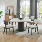 Valencia Dining Set - Round Marble for Six featuring a white faux marble table and six gray fabric chairs in a modern dining room setting.