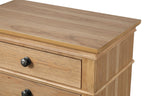 Close-up of Farmhouse Oak Nightstand top. Smooth pecan veneer surface with detailed wood grain and beveled edge.