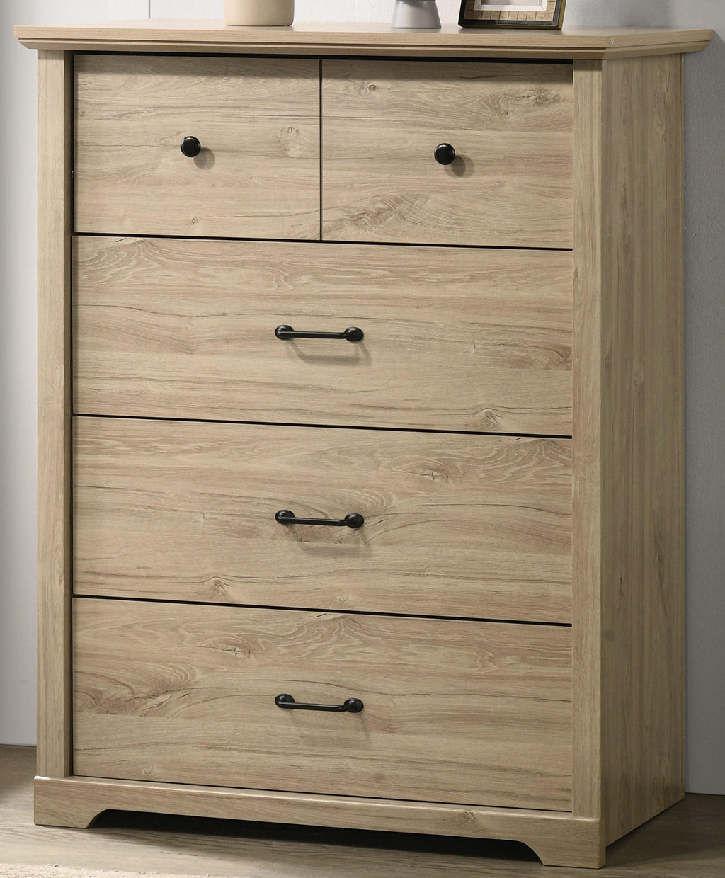 Elara 4-Drawer Light Oak Chest with Black Handles.
