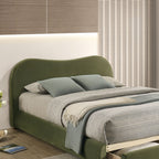 Detail view of Olive Green Velvet Queen Bed headboard. Smooth velvet finish and gentle curve add a modern touch.