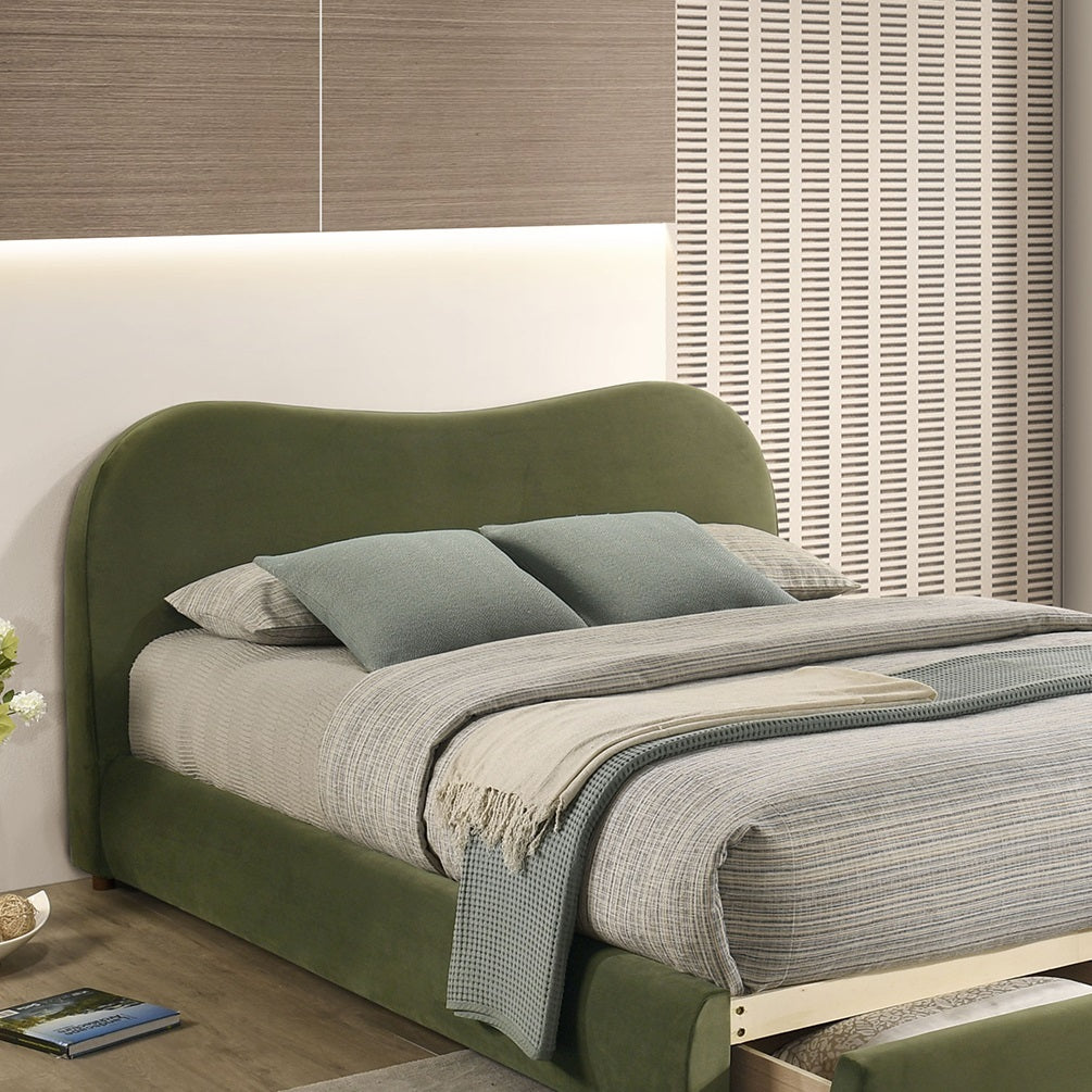 Detail view of Olive Green Velvet Queen Bed headboard. Smooth velvet finish and gentle curve add a modern touch.