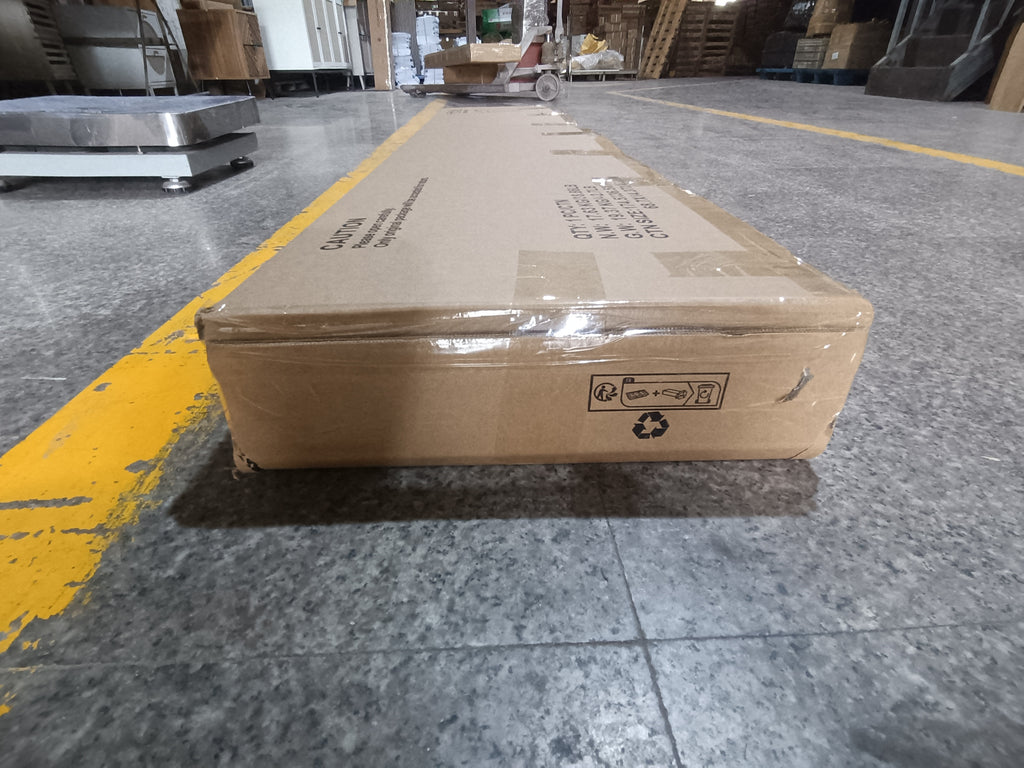 Sealed packaging of Farmhouse Oak Console Table - Extra-Long Entryway Table, showing compact box with handling and recycling symbols.