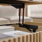 Close-up of lift mechanism inside solid wood coffee table, highlighting durable hardware and hidden storage space.