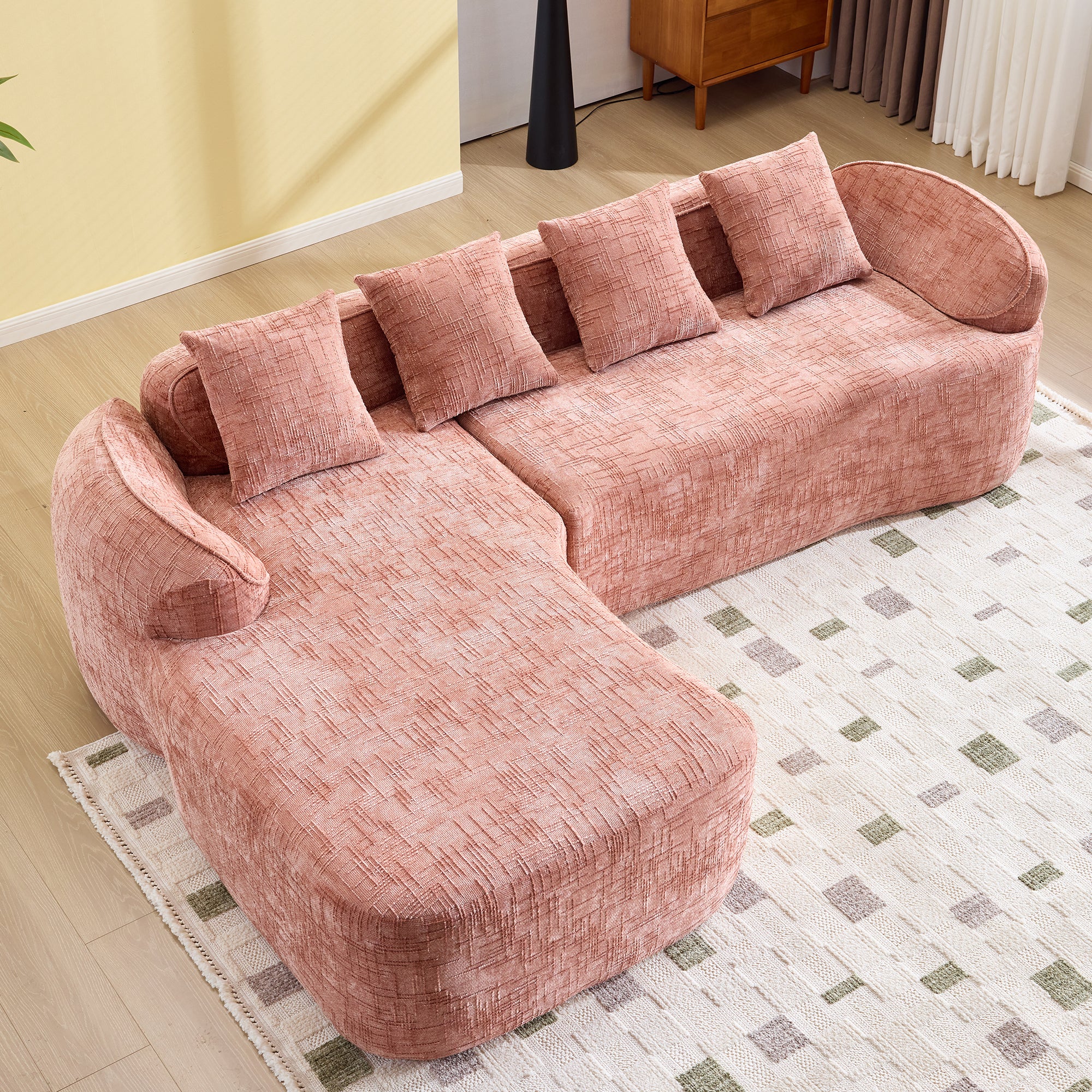 Top-down view of Pink Chenille L-Shaped Sofa with five matching pillows, showcasing its space-saving layout and cozy seating.