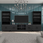 Radiance TV Stand 85 inch TVs - Black Finish as part of a full entertainment center with matching bookshelves and mounted TV.
