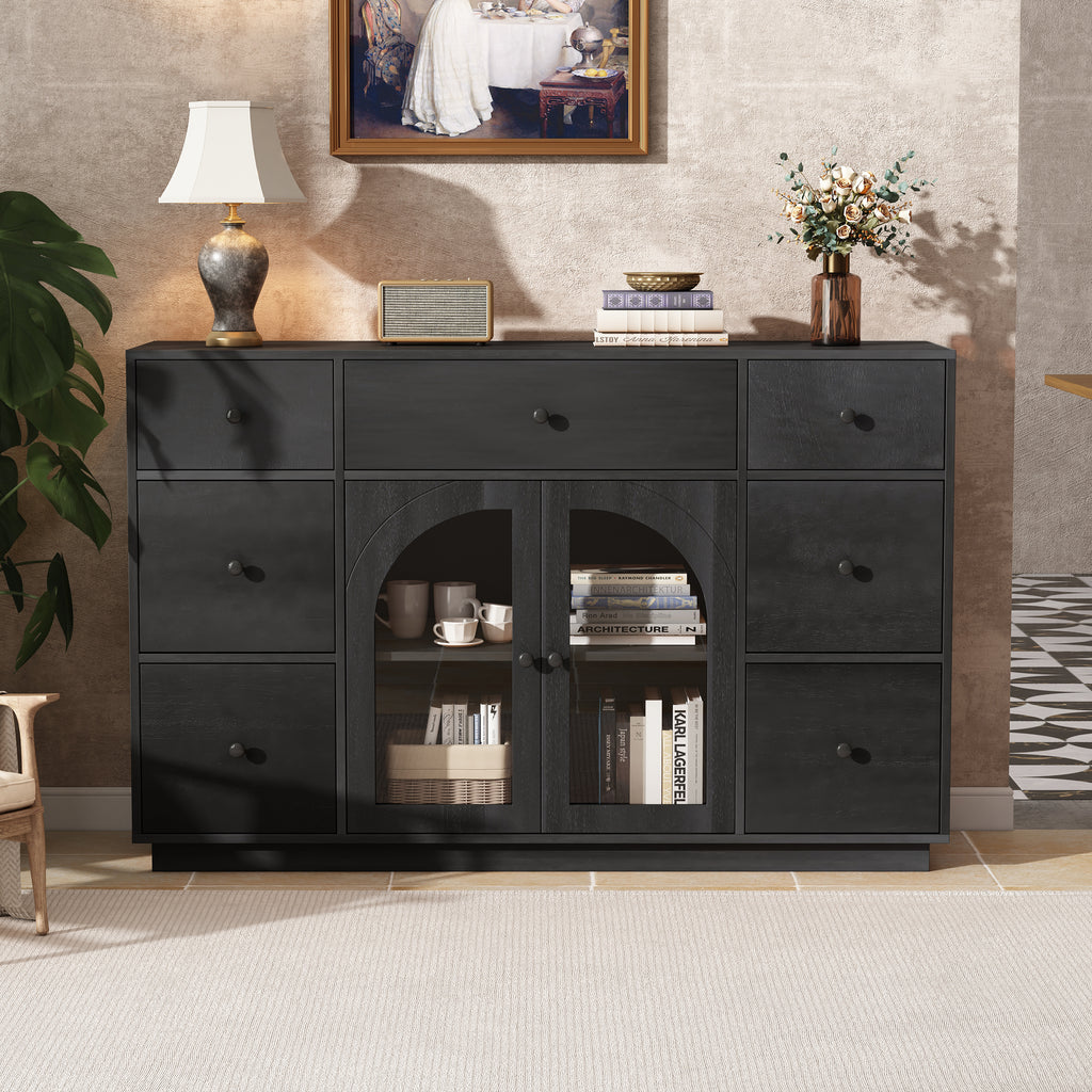 Large black wood buffet featuring two glass-paneled arched doors, seven drawers, and a sleek, contemporary design.