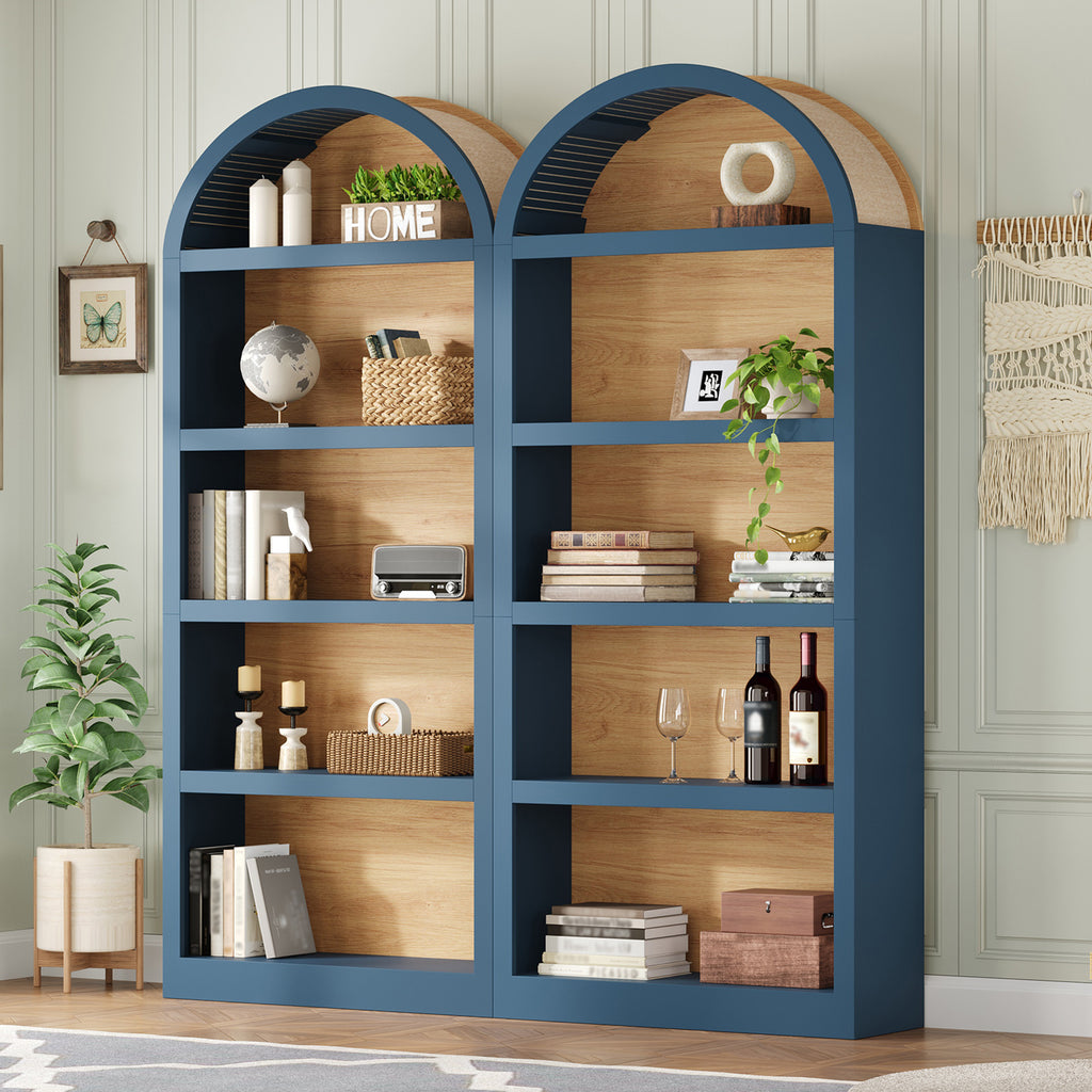 Set of two farmhouse-style blue and natural wood 5-tier bookcases with decorative arched tops and open storage.