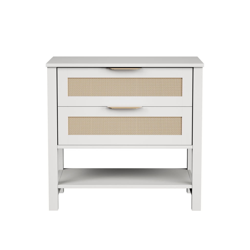 Boho white nightstand with two rattan-front drawers, gold handles, and an open storage shelf.