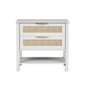 Boho white nightstand with two rattan-front drawers, gold handles, and an open storage shelf.