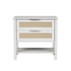 Boho white nightstand with two rattan-front drawers, gold handles, and an open storage shelf.