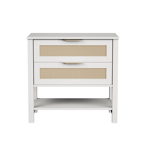 Boho white nightstand with two rattan-front drawers, gold handles, and an open storage shelf.