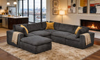 Dark gray modular sectional with deep-seated cushions, coffee bean-like texture, mustard toss pillows, and beige throws.