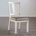 Transitional dining chair with oak finish, padded seat, and faceted backrest shown on wood flooring. Ideal for modern dining rooms.