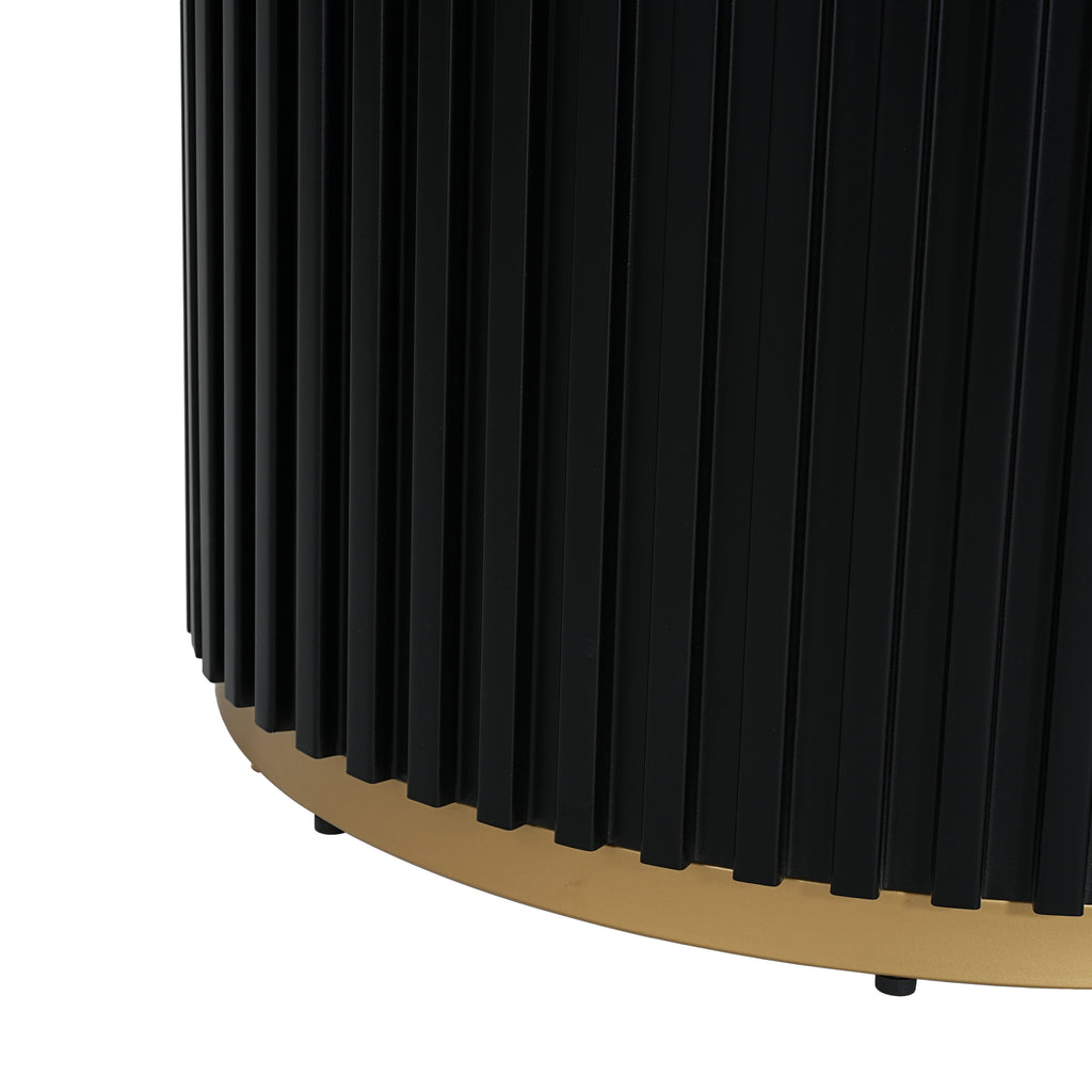 Close-up of fluted black pedestal base with gold trim. Sturdy iron construction enhances the table’s modern aesthetic.