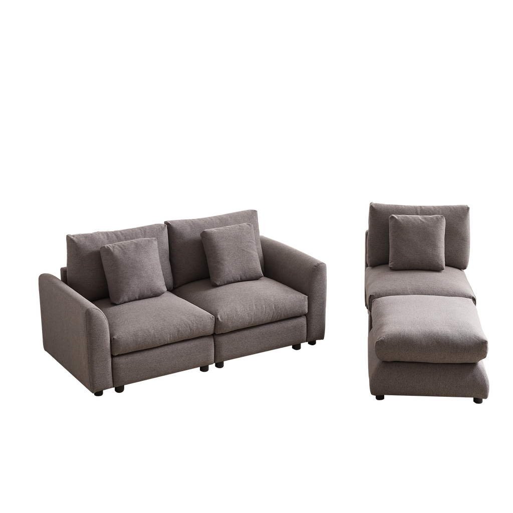 Modular sofa with ottoman in two separate sections, upholstered in soft gray fabric with matching cushions for versatile living room setups.
