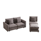 Modular sofa with ottoman in two separate sections, upholstered in soft gray fabric with matching cushions for versatile living room setups.