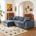 Modern L-shaped sofa with chaise in a cozy living room, upholstered in soft blue chenille with plush cushions and modular design.