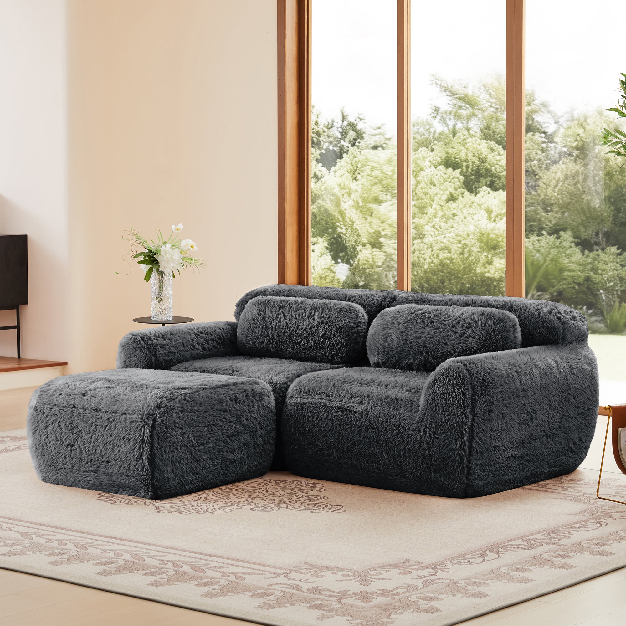 Modular plush L-shaped sectional sofa in dark grey with ergonomic chaise, soft texture and anti-slip base for comfort and stability.
