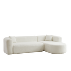 Angled product view of 109.4' modular sectional sofa in beige chenille fabric, highlighting its modern curves and plush seating.