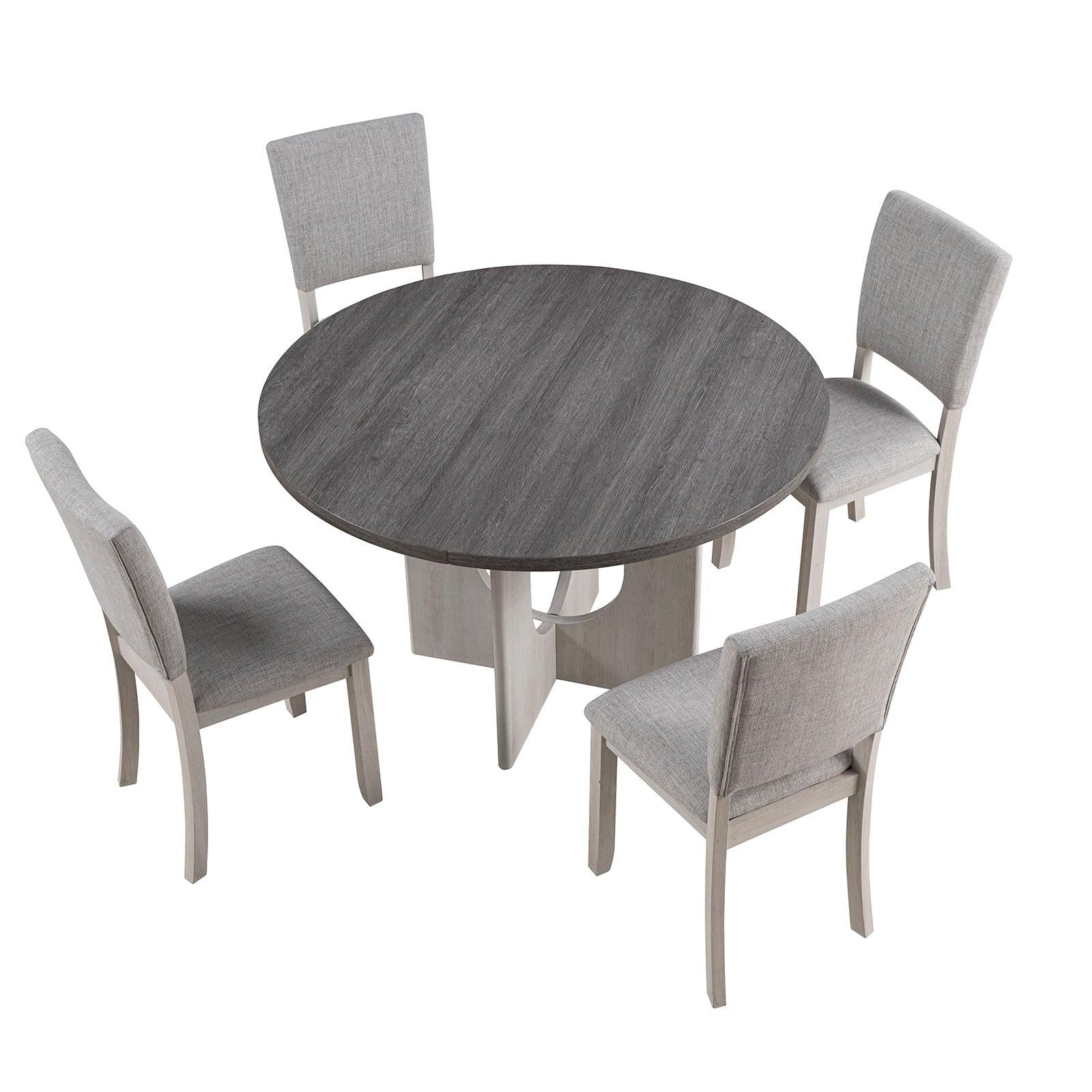 5pc dining set with gray upholstered chairs and round table.