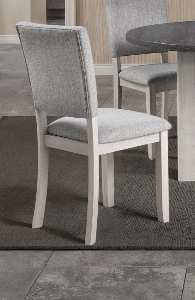 5pc dining set with gray upholstered chairs and round table.