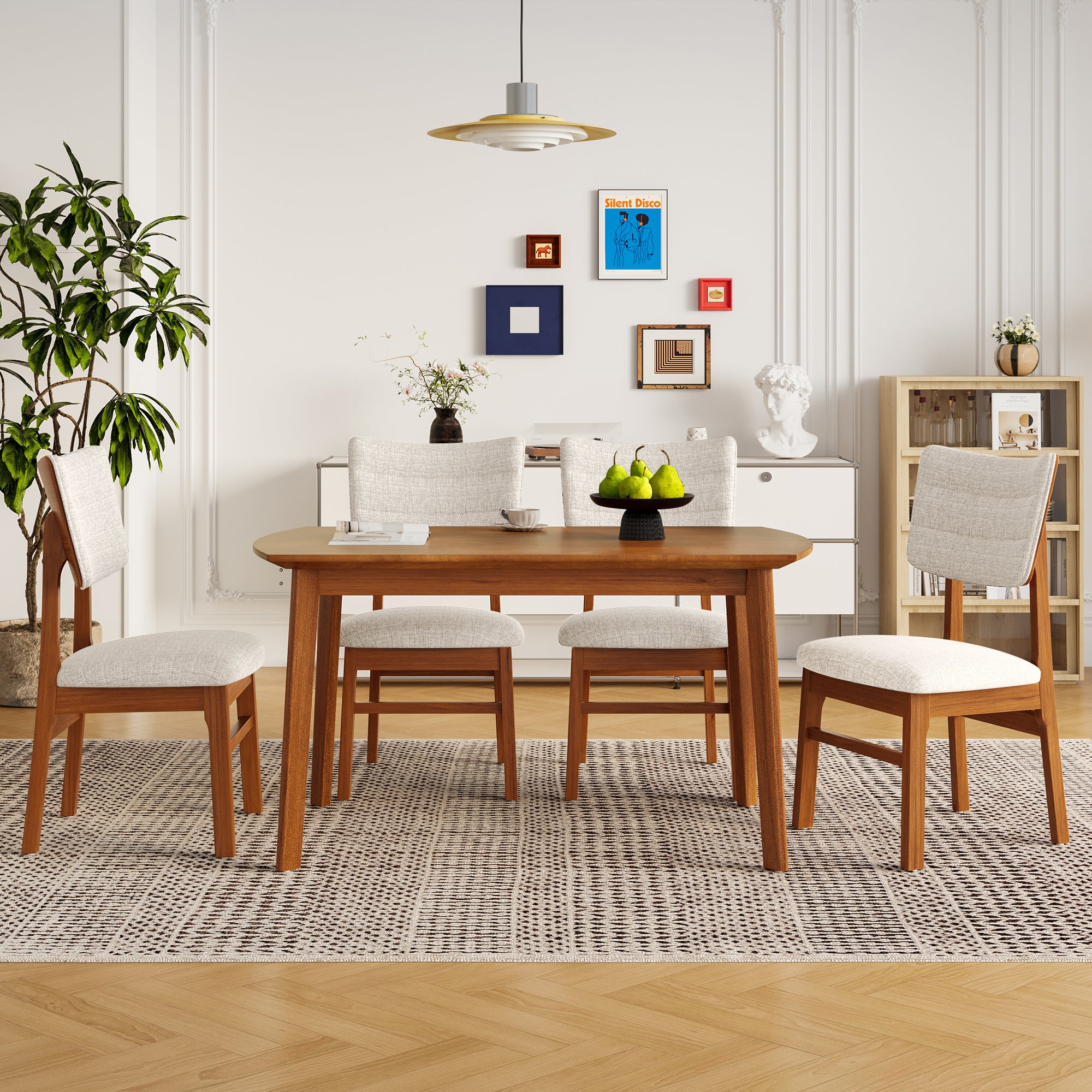 Mid-century modern farmhouse dining table set for 4 featuring ergonomic upholstered chairs and a sturdy wood table in a bright room.