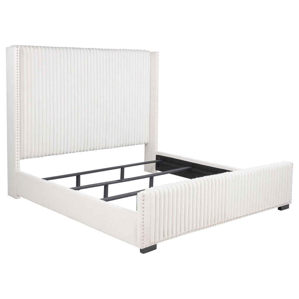 Cream California king bed frame with vertical channel tufting, nailhead trim, and a low-profile upholstered design.