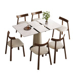 Modern 7-piece expandable dining table set with rock slab top and wooden chairs, displayed on a white background for product showcase.